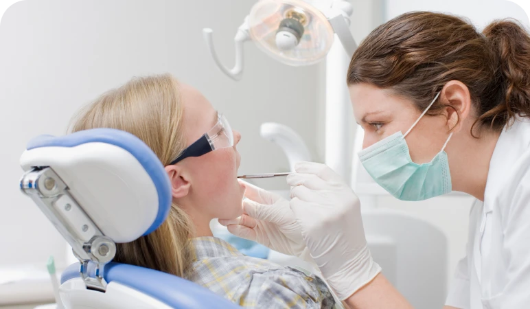 Dental check-up with patient and dentist