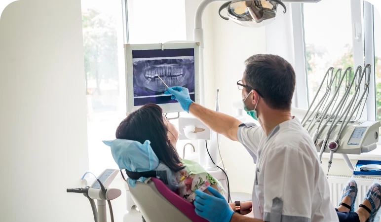 Dentist explaining X-ray to patient